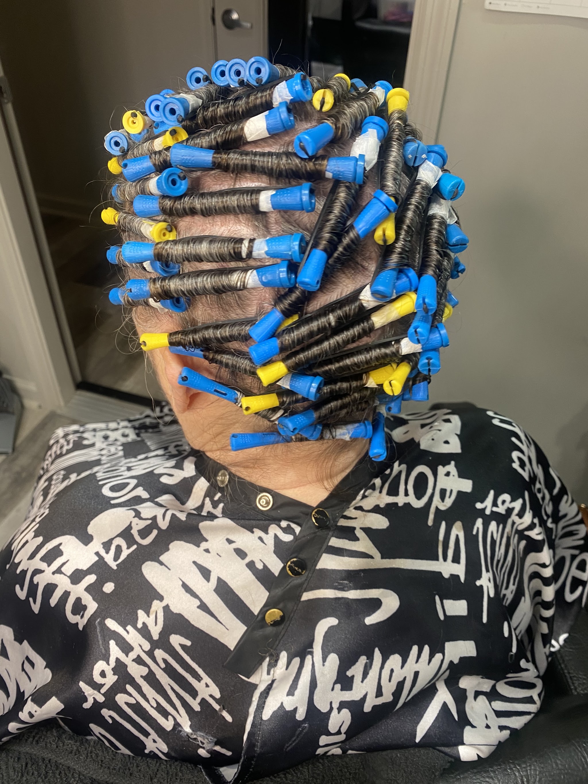 Perm rods set in a client's hair